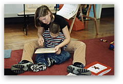 Teacher and Child Using Readiness Book